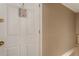 The home's entryway with a white front door and neutral-colored walls create a welcoming entrance at 6637 Oak Farm Se Dr, Acworth, GA 30102