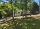 Traditional home featuring a well-kept lawn, front porch, and inviting curb appeal at 6637 Oak Farm Se Dr, Acworth, GA 30102