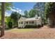 Charming cottage-style home with a manicured lawn and inviting front porch at 6637 Oak Farm Se Dr, Acworth, GA 30102