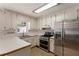 Well-lit kitchen features stainless steel appliances, double oven, and ample counter space at 6637 Oak Farm Se Dr, Acworth, GA 30102