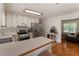 Bright eat-in kitchen features stainless appliances, ample counter space, and an open flow into the dining area at 6637 Oak Farm Se Dr, Acworth, GA 30102