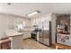 Eat-in kitchen includes stainless appliances, gas range, and white cabinets for a bright, clean look at 6637 Oak Farm Se Dr, Acworth, GA 30102