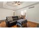 Bright living room featuring hardwood floors and an open view to the dining room at 6637 Oak Farm Se Dr, Acworth, GA 30102