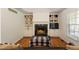 Inviting living room featuring built-in shelving and a fireplace at 6637 Oak Farm Se Dr, Acworth, GA 30102