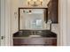 Bathroom view featuring a dark wood vanity with a granite countertop at 2161 Peachtree Rd # Apt 706, Atlanta, GA 30309