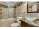 Elegant bathroom featuring a modern vanity, marble countertops, and a glass shower enclosure at 2161 Peachtree Rd # Apt 706, Atlanta, GA 30309