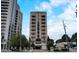 Exterior shot of building showing balconies, entrances, and surrounding buildings at 2161 Peachtree Rd # Apt 706, Atlanta, GA 30309