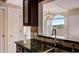 Modern kitchen featuring granite countertop and stainless steel sink at 2161 Peachtree Rd # Apt 706, Atlanta, GA 30309