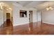 Open living space with hardwood floors leading to kitchen and hallways at 2161 Peachtree Rd # Apt 706, Atlanta, GA 30309