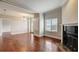 Bright living room with fireplace, hardwood floors and view from large window at 2161 Peachtree Rd # Apt 706, Atlanta, GA 30309
