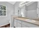 Bathroom featuring a vanity with cabinets, and a framed mirror at 3020 Meadow Glen Pass, Fairburn, GA 30213