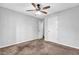 Bedroom with a ceiling fan and a closet door at 3020 Meadow Glen Pass, Fairburn, GA 30213