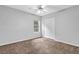 Bedroom showcasing carpet, window, and a closet at 3020 Meadow Glen Pass, Fairburn, GA 30213