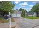 Two-story home with a two-car garage and a well-maintained front yard at 3020 Meadow Glen Pass, Fairburn, GA 30213