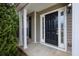 Inviting front door with sidelights and columns at 3020 Meadow Glen Pass, Fairburn, GA 30213