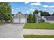 Charming single-Gathering home with a well-manicured lawn, two-car garage, and inviting curb appeal at 3020 Meadow Glen Pass, Fairburn, GA 30213