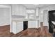 Well-lit kitchen featuring white cabinets and modern appliances at 3020 Meadow Glen Pass, Fairburn, GA 30213