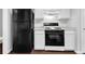 Bright kitchen with white cabinets and a gas oven at 3020 Meadow Glen Pass, Fairburn, GA 30213
