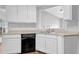 Updated kitchen with white cabinets and modern appliances at 3020 Meadow Glen Pass, Fairburn, GA 30213