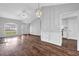 Open concept living room with hardwood floors, lots of light and an adjacent kitchen at 3020 Meadow Glen Pass, Fairburn, GA 30213