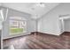 Bright living room with large windows and hardwood floors at 3020 Meadow Glen Pass, Fairburn, GA 30213