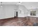 Spacious living room area featuring hardwood floors and large windows at 3020 Meadow Glen Pass, Fairburn, GA 30213
