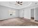 Spacious main bedroom featuring a tray ceiling and an ensuite bathroom at 3020 Meadow Glen Pass, Fairburn, GA 30213