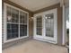 Back patio with large windows and double doors at 3020 Meadow Glen Pass, Fairburn, GA 30213