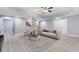 Finished basement with stylish furniture, neutral tones, and luxury vinyl flooring at 3302 Anna Ruby Ln, Buford, GA 30519