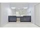 Bathroom with double sinks, modern vanities, large mirror and lots of storage space at 3302 Anna Ruby Ln, Buford, GA 30519