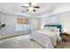 Comfortable bedroom with a tray ceiling and a large window for natural light at 3302 Anna Ruby Ln, Buford, GA 30519