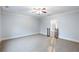 Spacious bonus room featuring neutral carpeting and a ceiling fan at 3302 Anna Ruby Ln, Buford, GA 30519