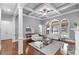 Elegant living room boasting coffered ceilings, large windows, and a cozy fireplace at 3302 Anna Ruby Ln, Buford, GA 30519
