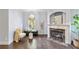 Inviting living room features a cozy fireplace, and elegant decor perfect for relaxation and entertaining at 3302 Anna Ruby Ln, Buford, GA 30519
