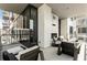 Relax on this comfortable balcony with stylish furniture and a cozy fireplace, perfect for outdoor lounging at 40 12Th Ne St # 1406, Atlanta, GA 30309