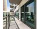 A condo balcony with views of surrounding buildings and city architecture, offering outdoor living space at 40 12Th Ne St # 1406, Atlanta, GA 30309