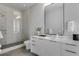 A modern bathroom with sleek vanity, a frameless shower, and contemporary finishes, designed for a clean aesthetic at 40 12Th Ne St # 1406, Atlanta, GA 30309