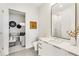Modern bathroom featuring a large mirror, sleek vanity, and decorative accents at 40 12Th Ne St # 1406, Atlanta, GA 30309