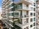 A modern high-rise with multiple balconies offering city views, inviting residents to enjoy urban living at 40 12Th Ne St # 1406, Atlanta, GA 30309