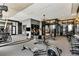 A spacious gym features modern exercise equipment and weights, for a complete workout experience at 40 12Th Ne St # 1406, Atlanta, GA 30309