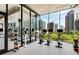Modern gym includes treadmills, stationary bikes, and weights, all with a panoramic city view at 40 12Th Ne St # 1406, Atlanta, GA 30309
