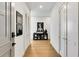 Hallway featuring hardwood floors, white walls, and stylish decor at 40 12Th Ne St # 1406, Atlanta, GA 30309