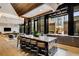 Open-concept kitchen with a large marble island with barstool seating, with a lounge area in the background at 40 12Th Ne St # 1406, Atlanta, GA 30309