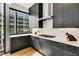 Modern kitchen featuring dark cabinets, stainless steel appliances, and hardwood floors at 40 12Th Ne St # 1406, Atlanta, GA 30309
