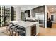 Modern kitchen with a large island, stainless steel appliances, and stylish bar stools at 40 12Th Ne St # 1406, Atlanta, GA 30309