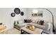 A cozy living room with sectional sofa, decor, and a painting, creating a warm and inviting space at 40 12Th Ne St # 1406, Atlanta, GA 30309