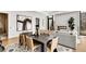 Open concept living room and dining area with hardwood floors, fireplace, and modern furniture at 40 12Th Ne St # 1406, Atlanta, GA 30309