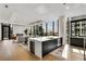 Spacious living room with a large island, hardwood floors, and city views at 40 12Th Ne St # 1406, Atlanta, GA 30309