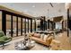 Modern lounge area with a comfortable sofa and open-air seating with beautiful lighting fixtures at 40 12Th Ne St # 1406, Atlanta, GA 30309