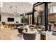 Lounge with gray accent chairs and a long dining table and chairs at 40 12Th Ne St # 1406, Atlanta, GA 30309